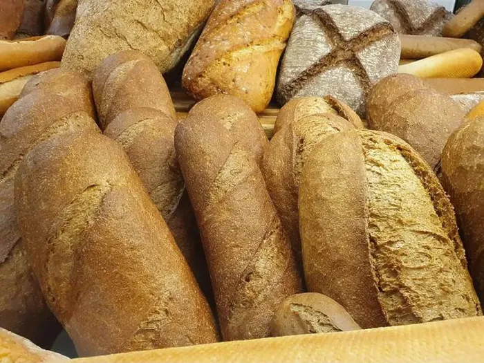 Framed Print : Delicious and fresh bread. The flavored bread is baked in the bakery and placed on the shelf for sale Framed Print : Delicious and fresh bread. The flavored bread is baked in the bakery and placed on the shelf for sale