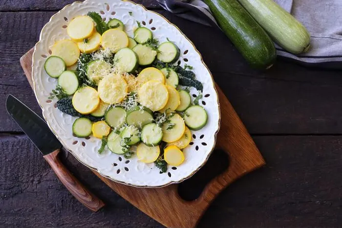 Framed Print : Delicious fresh salad with zucchini, kale and parmesan cheese with spices and olive oil. Selective focus, top view Framed Print : Delicious fresh salad with zucchini, kale and parmesan cheese with spices and olive oil. Selective focus, top view