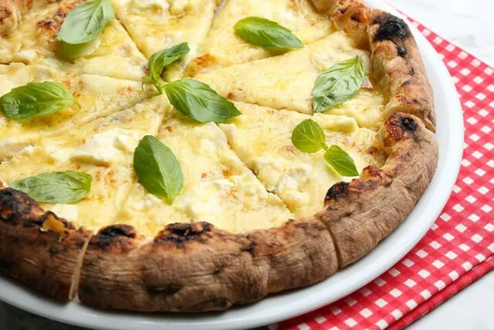 Framed Print : Delicious hot cheese pizza with basil on table, closeup Framed Print : Delicious hot cheese pizza with basil on table, closeup