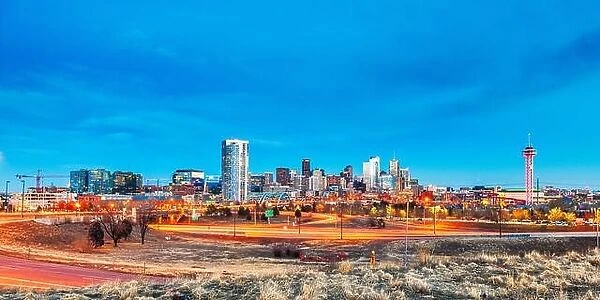 Denver, Colorado, USA downtown city skyline and highways at dawn