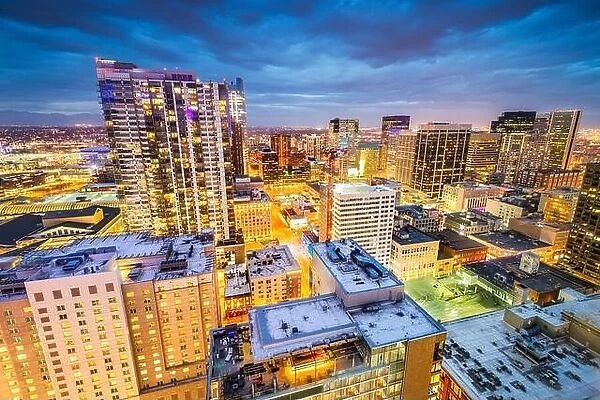 Denver, Colorado, USA downtown cityscape rooftop view at dusk with storm clouds rolloing in