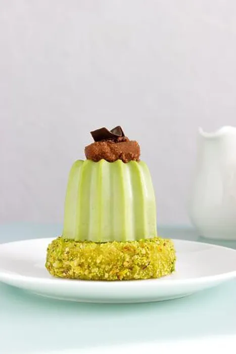 Framed Print : Dessert Pistachio mousse with cherry brownie on pistachio dacquoise on white plate Framed Print : Dessert Pistachio mousse with cherry brownie on pistachio dacquoise on white plate