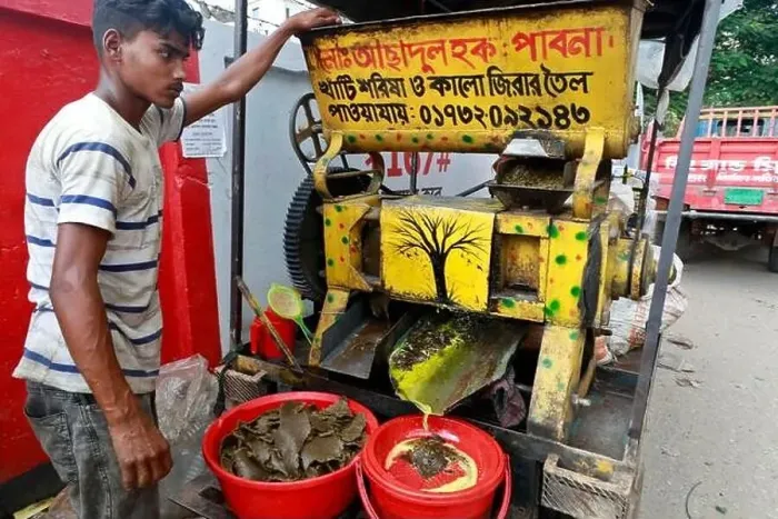 Framed Print : Dhaka, Bangladesh - August 22, 2021: A mustard oil seller in Badda Framed Print : Dhaka, Bangladesh - August 22, 2021: A mustard oil seller in Badda