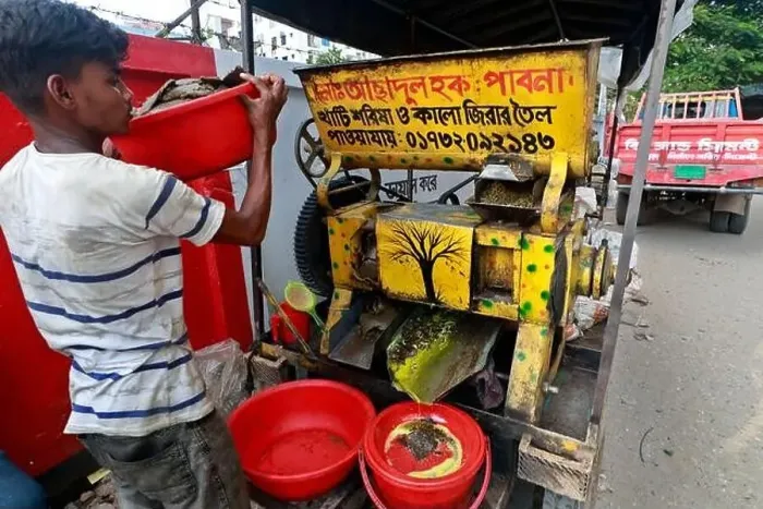 Framed Print : Dhaka, Bangladesh - August 22, 2021: A mustard oil seller in Badda Framed Print : Dhaka, Bangladesh - August 22, 2021: A mustard oil seller in Badda