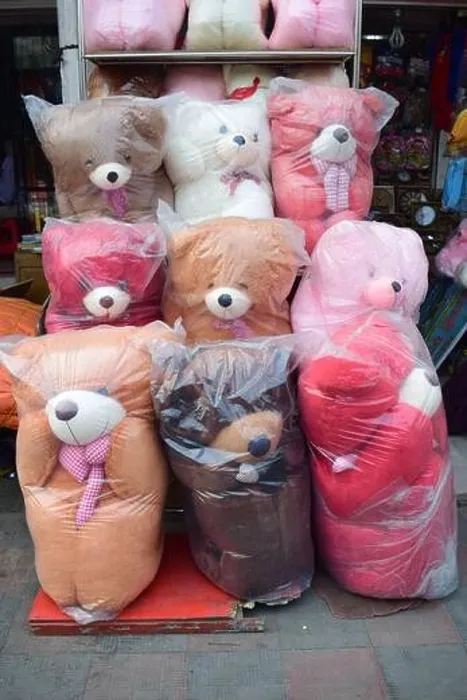 Framed Print : Different size and color teddy bears kept in front of a shop for sell Framed Print : Different size and color teddy bears kept in front of a shop for sell