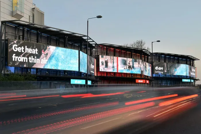 Framed Print : Digital advertising hoardings promoting the domestic energy company E-on on the Talgarth Road Framed Print : Digital advertising hoardings promoting the domestic energy company E-on on the Talgarth Road