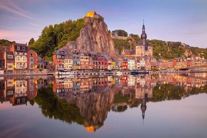 Framed Print : Dinant, Belgium. Cityscape image of beautiful historical city of Dinant with the reflection of the city in the Meuse River at summer sunset Framed Print : Dinant, Belgium. Cityscape image of beautiful historical city of Dinant with the reflection of the city in the Meuse River at summer sunset