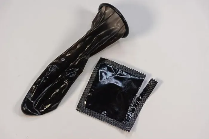 Framed Print : Display of colored condom arranged neatly on a platform