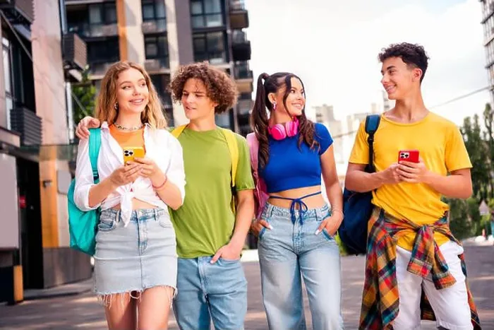 Framed Print : Four diverse friends enjoying their time together outdoors in a vibrant urban setting showing genuine smiles and bonding Framed Print : Four diverse friends enjoying their time together outdoors in a vibrant urban setting showing genuine smiles and bonding