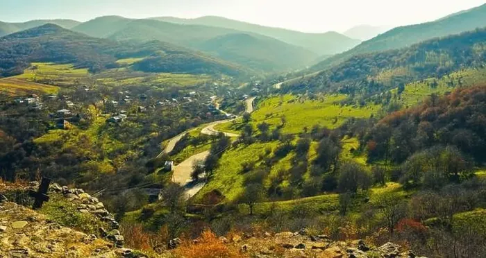 Framed Print : Dmanisi countryside panorama with traditional georgian houses, road and mountains background Framed Print : Dmanisi countryside panorama with traditional georgian houses, road and mountains background