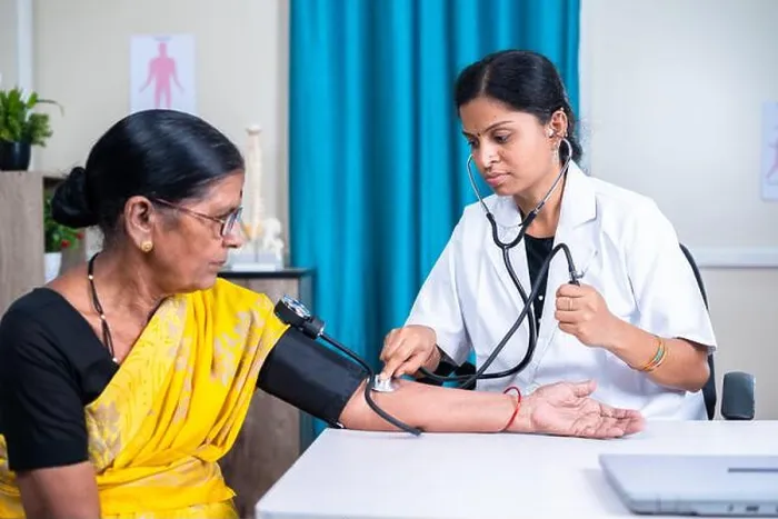 Framed Print : Doctor checking blood pressure or bp of senior woman patient at hospital - concept of health care Framed Print : Doctor checking blood pressure or bp of senior woman patient at hospital - concept of health care
