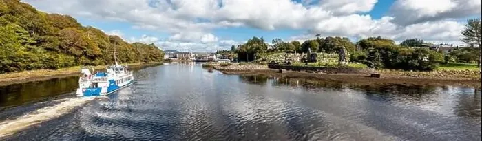 Framed Print : DONEGAL TOWN, COUNTY DONEGAL, IRELAND - SEPTEMBER 22 2022 : The waterbus arriving to the town Framed Print : DONEGAL TOWN, COUNTY DONEGAL, IRELAND - SEPTEMBER 22 2022 : The waterbus arriving to the town