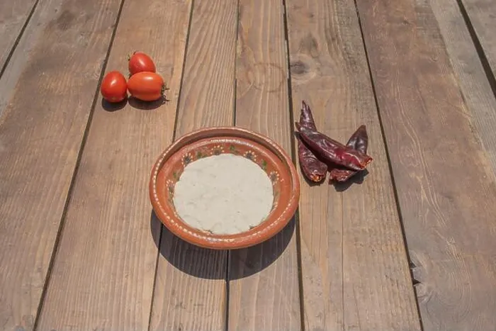 Framed Print : dough for Mexican tortillas in clay plate on table with chili peppers and tomatoes