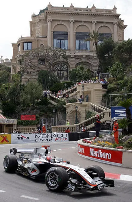 Framed Print : (dpa) - Finnish Formula One driver Kimi Raikkonen of McLaren Mercedes leads the Monaco Grand Prix in Monte Carlo