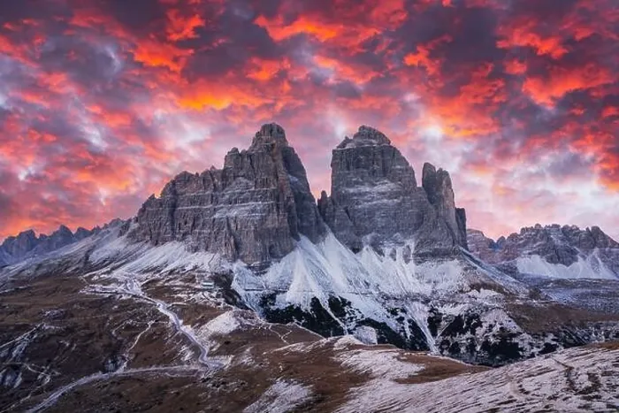 Framed Print : Dramatic evening landscape with Three peaks of Lavaredo mountains, glowing road and pink sunset sky Framed Print : Dramatic evening landscape with Three peaks of Lavaredo mountains, glowing road and pink sunset sky