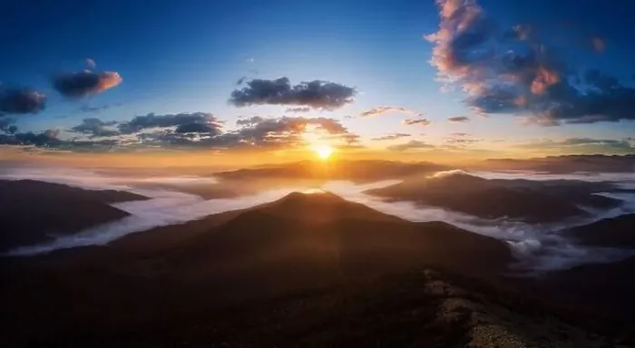 Framed Print : Dramatic landscape in Carpathian mountains with morning fog in valley and beautiful sky at sunrise