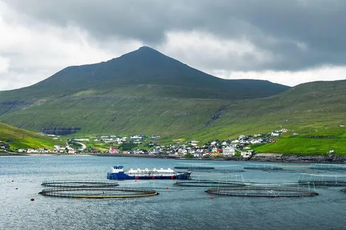 Framed Print : Dramatic morning view on Sandavagur village and fish farm on Vagar island, Faroe Islands, Denmark. Landscape photography