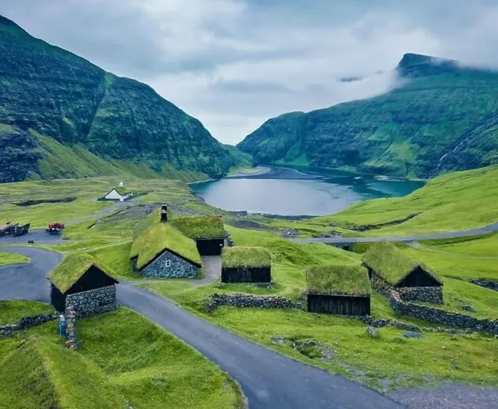 Framed Print : Dramatic summer view from flying drone of Saksun village with traditional turf-top house Framed Print : Dramatic summer view from flying drone of Saksun village with traditional turf-top house