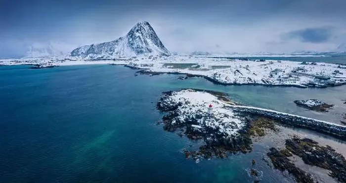 Framed Print : Dramatic winter view from flying drone of small fishing village - Hovsund