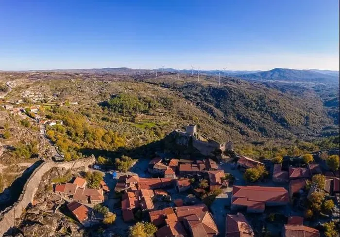 Framed Print : Drone aerial panorama of historic village of Sortelha with castle and with turbines on natural landscape, in Portugal Framed Print : Drone aerial panorama of historic village of Sortelha with castle and with turbines on natural landscape, in Portugal