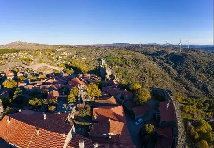 Framed Print : Drone aerial panorama of historic village of Sortelha with castle and with turbines on natural landscape, in Portugal Framed Print : Drone aerial panorama of historic village of Sortelha with castle and with turbines on natural landscape, in Portugal