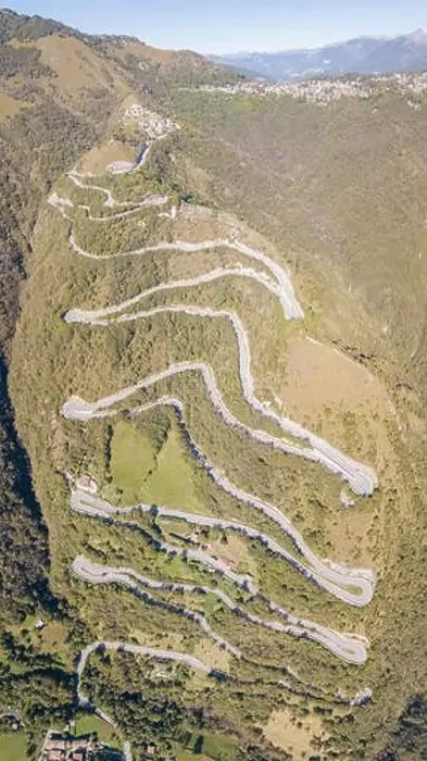 Framed Print : Up and down drone aerial view of the mountain road in Italy from the village of Nembro to Selvino