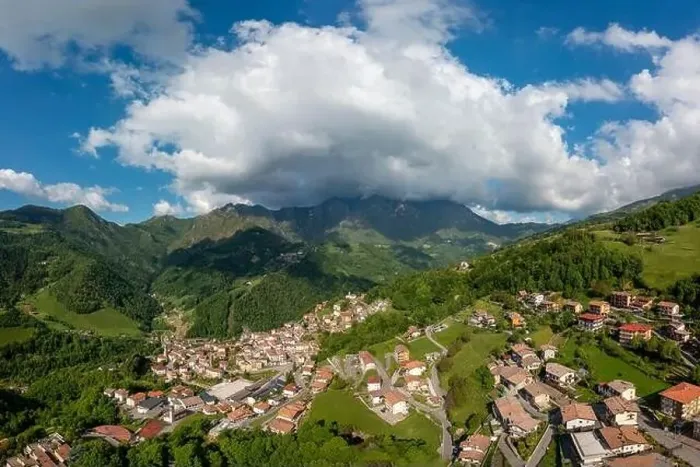 Framed Print : Drone aerial view to the Seriana valley and Orobie Alps with big cloud and blue sky Framed Print : Drone aerial view to the Seriana valley and Orobie Alps with big cloud and blue sky