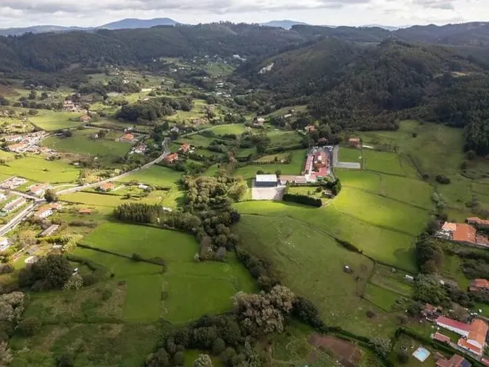 Framed Print : A drone captures the tranquil beauty of a green rural area with sports fields among rolling hills Framed Print : A drone captures the tranquil beauty of a green rural area with sports fields among rolling hills