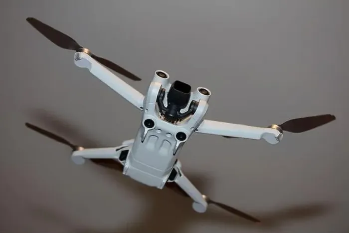 Framed Print : The drone copter flying with digital camera isolated on empty colorful background grey drones quad with sensors fly Framed Print : The drone copter flying with digital camera isolated on empty colorful background grey drones quad with sensors fly