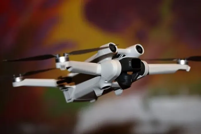 Framed Print : The drone copter flying with digital camera isolated on empty colorful background grey drones quad with sensors fly Framed Print : The drone copter flying with digital camera isolated on empty colorful background grey drones quad with sensors fly