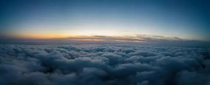 Framed Print : A drone flies over fluffy clouds at sunset. The drone flies through the clouds, creating a sense of wonder and awe Framed Print : A drone flies over fluffy clouds at sunset. The drone flies through the clouds, creating a sense of wonder and awe