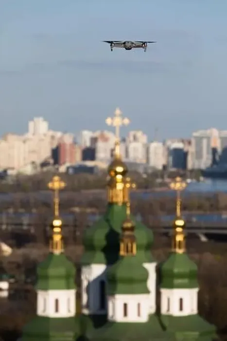 Framed Print : Drone flies over Vydubychi Monastery in Kyiv. Domes of the Christian monastery. Focus on drone with blurred background Framed Print : Drone flies over Vydubychi Monastery in Kyiv. Domes of the Christian monastery. Focus on drone with blurred background