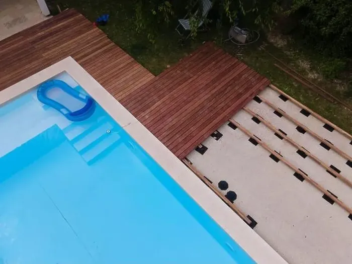 Framed Print : Drone flight over beautiful green garden with pool and the wooden terrace of the pool is currently in progress Framed Print : Drone flight over beautiful green garden with pool and the wooden terrace of the pool is currently in progress