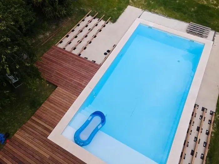 Framed Print : Drone flight over beautiful green garden with pool and the wooden terrace of the pool is currently in progress Framed Print : Drone flight over beautiful green garden with pool and the wooden terrace of the pool is currently in progress