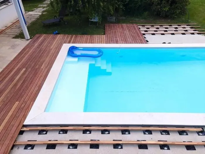 Framed Print : Drone flight over beautiful green garden with pool and the wooden terrace of the pool is currently in progress Framed Print : Drone flight over beautiful green garden with pool and the wooden terrace of the pool is currently in progress