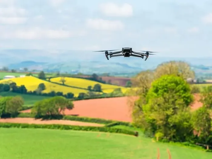 Framed Print : Drone in flight over fields and farms, Devon, England Framed Print : Drone in flight over fields and farms, Devon, England