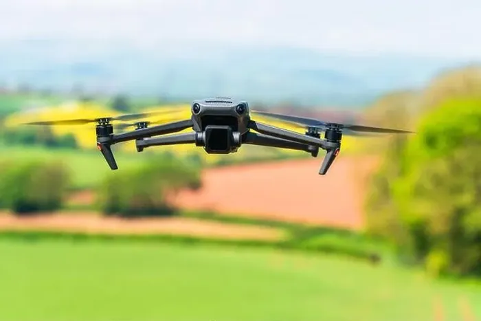 Framed Print : Drone in flight over fields and farms, Devon, England Framed Print : Drone in flight over fields and farms, Devon, England