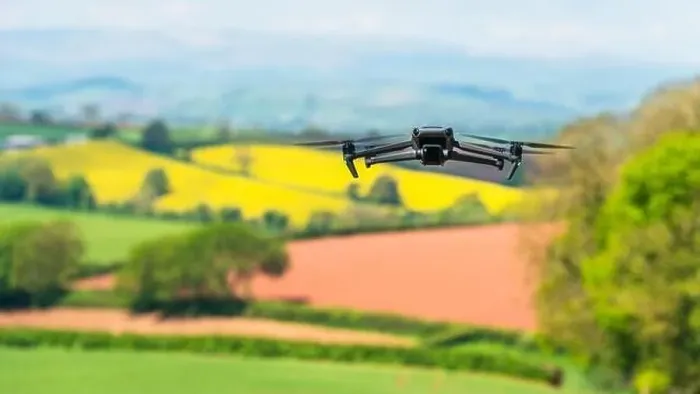 Framed Print : Drone in flight over fields and farms, Devon, England Framed Print : Drone in flight over fields and farms, Devon, England
