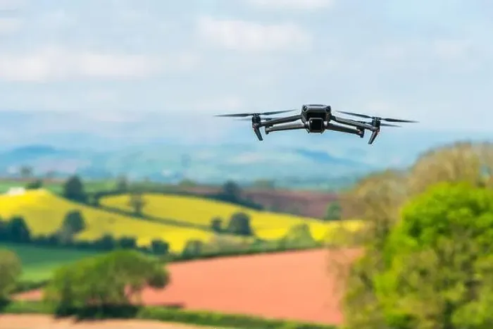 Framed Print : Drone in flight over fields and farms, Devon, England Framed Print : Drone in flight over fields and farms, Devon, England