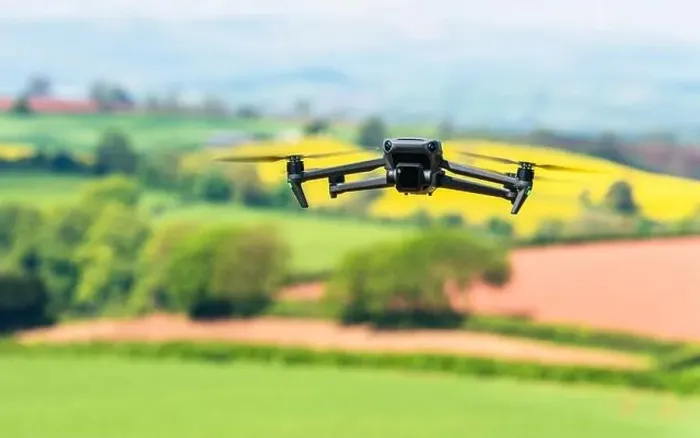 Framed Print : Drone in flight over fields and farms, Devon, England Framed Print : Drone in flight over fields and farms, Devon, England