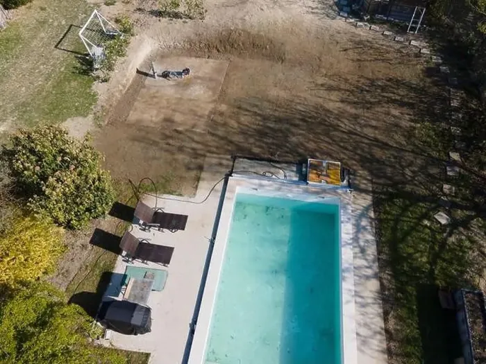 Framed Print : Drone flight over fresh earth area with grass grown next to pool construction site in April Framed Print : Drone flight over fresh earth area with grass grown next to pool construction site in April
