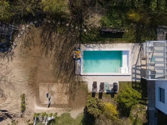 Framed Print : Drone flight over fresh earth area with grass grown next to pool construction site in April Framed Print : Drone flight over fresh earth area with grass grown next to pool construction site in April