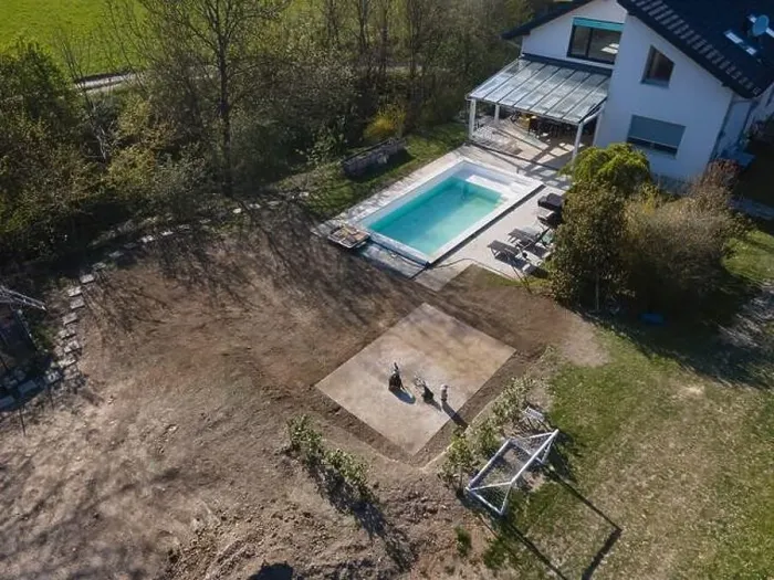 Framed Print : Drone flight over fresh earth area with grass grown next to pool construction site in April Framed Print : Drone flight over fresh earth area with grass grown next to pool construction site in April