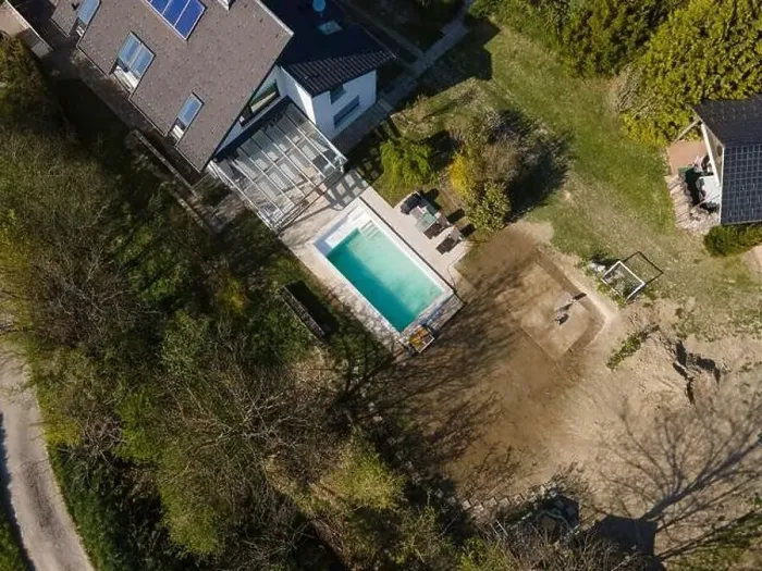 Framed Print : Drone flight over fresh earth area with grass grown next to pool construction site in April Framed Print : Drone flight over fresh earth area with grass grown next to pool construction site in April