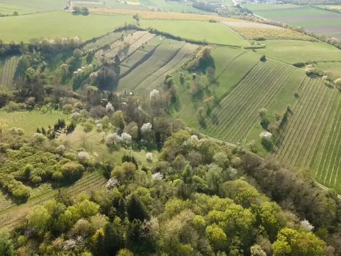 Framed Print : Drone flight over green meadows, forests, landscape, nature in April in Austria Framed Print : Drone flight over green meadows, forests, landscape, nature in April in Austria