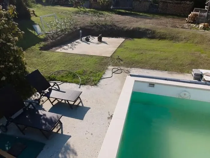 Framed Print : Drone flight over pool in the middle of greenery, fresh grass grown and the pool is not yet cleaned Framed Print : Drone flight over pool in the middle of greenery, fresh grass grown and the pool is not yet cleaned