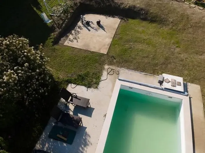 Framed Print : Drone flight over pool in the middle of greenery, fresh grass grown and the pool is not yet cleaned Framed Print : Drone flight over pool in the middle of greenery, fresh grass grown and the pool is not yet cleaned