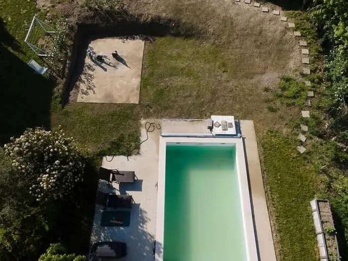 Framed Print : Drone flight over pool in the middle of greenery, fresh grass grown and the pool is not yet cleaned Framed Print : Drone flight over pool in the middle of greenery, fresh grass grown and the pool is not yet cleaned