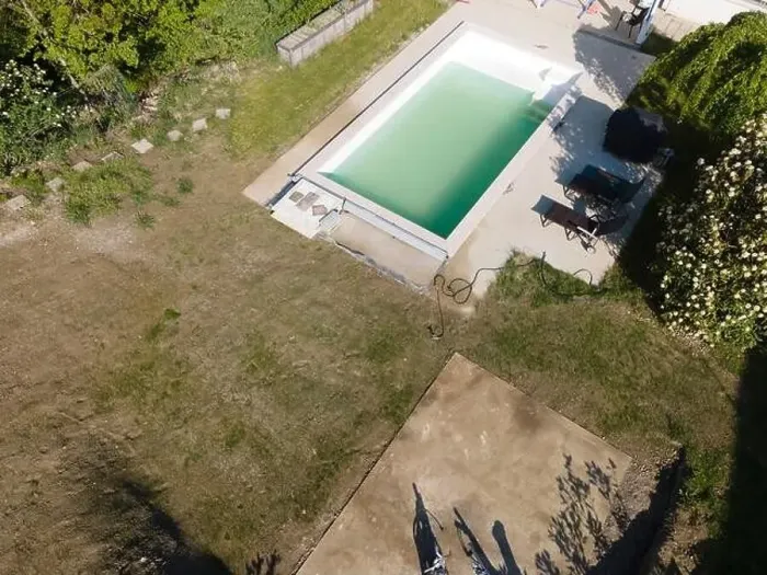 Framed Print : Drone flight over pool in the middle of greenery, fresh grass grown and the pool is not yet cleaned Framed Print : Drone flight over pool in the middle of greenery, fresh grass grown and the pool is not yet cleaned