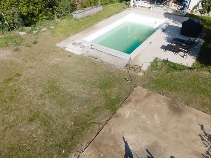 Framed Print : Drone flight over pool in the middle of greenery, fresh grass grown and the pool is not yet cleaned Framed Print : Drone flight over pool in the middle of greenery, fresh grass grown and the pool is not yet cleaned